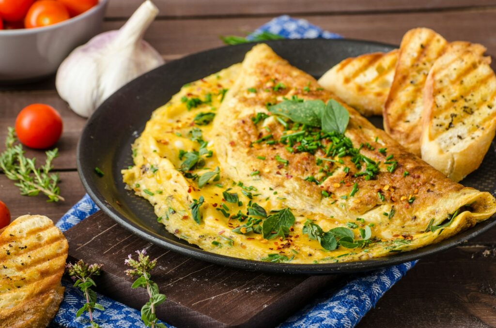 Herb omelette with chives and oregano sprinkled with Herb omelette with chili flakes